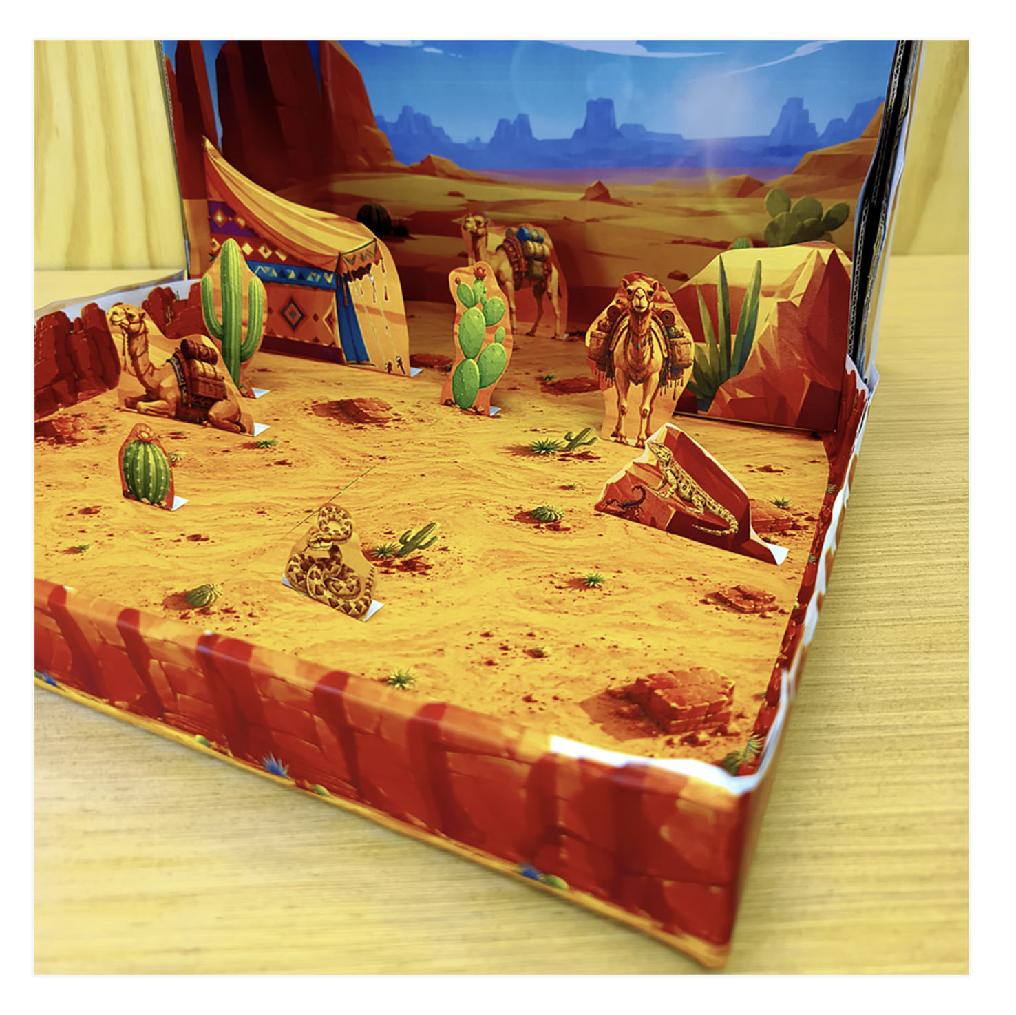 Close-up detail of camels and desert scenery in a printable shoebox diorama