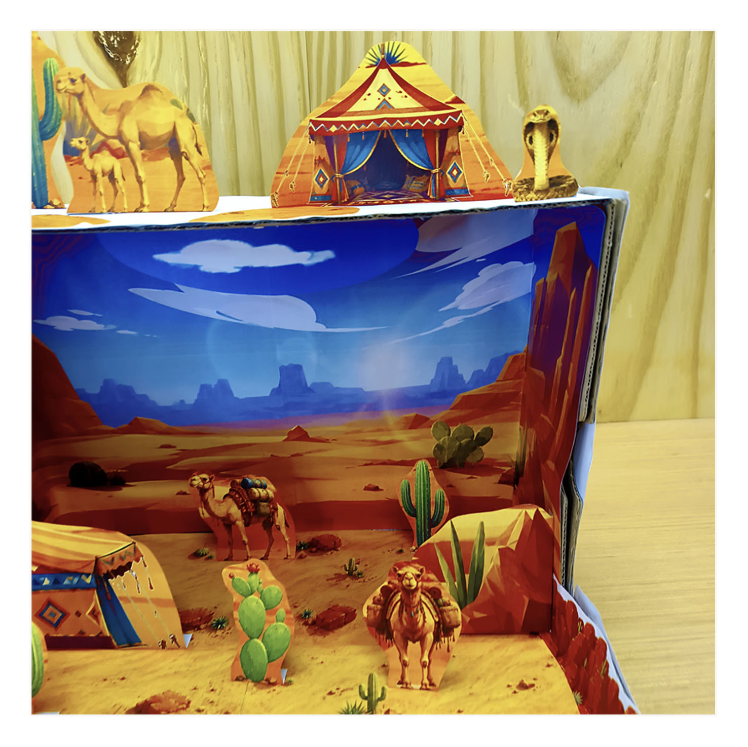 Close-up detail of a tent, plants and desert habitat scenery in a shoebox craft