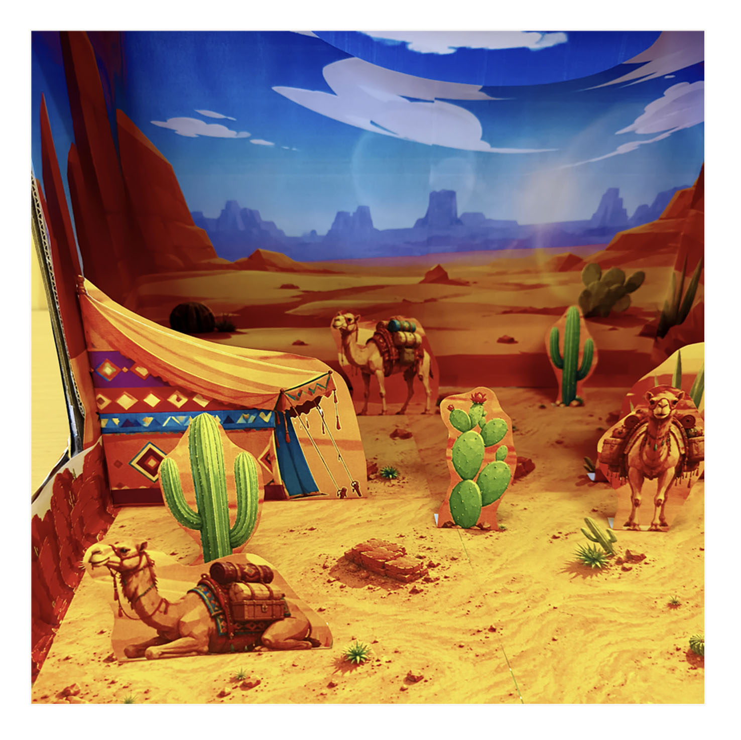 Close-up of layered desert animals and landscape details in a printable paper diorama