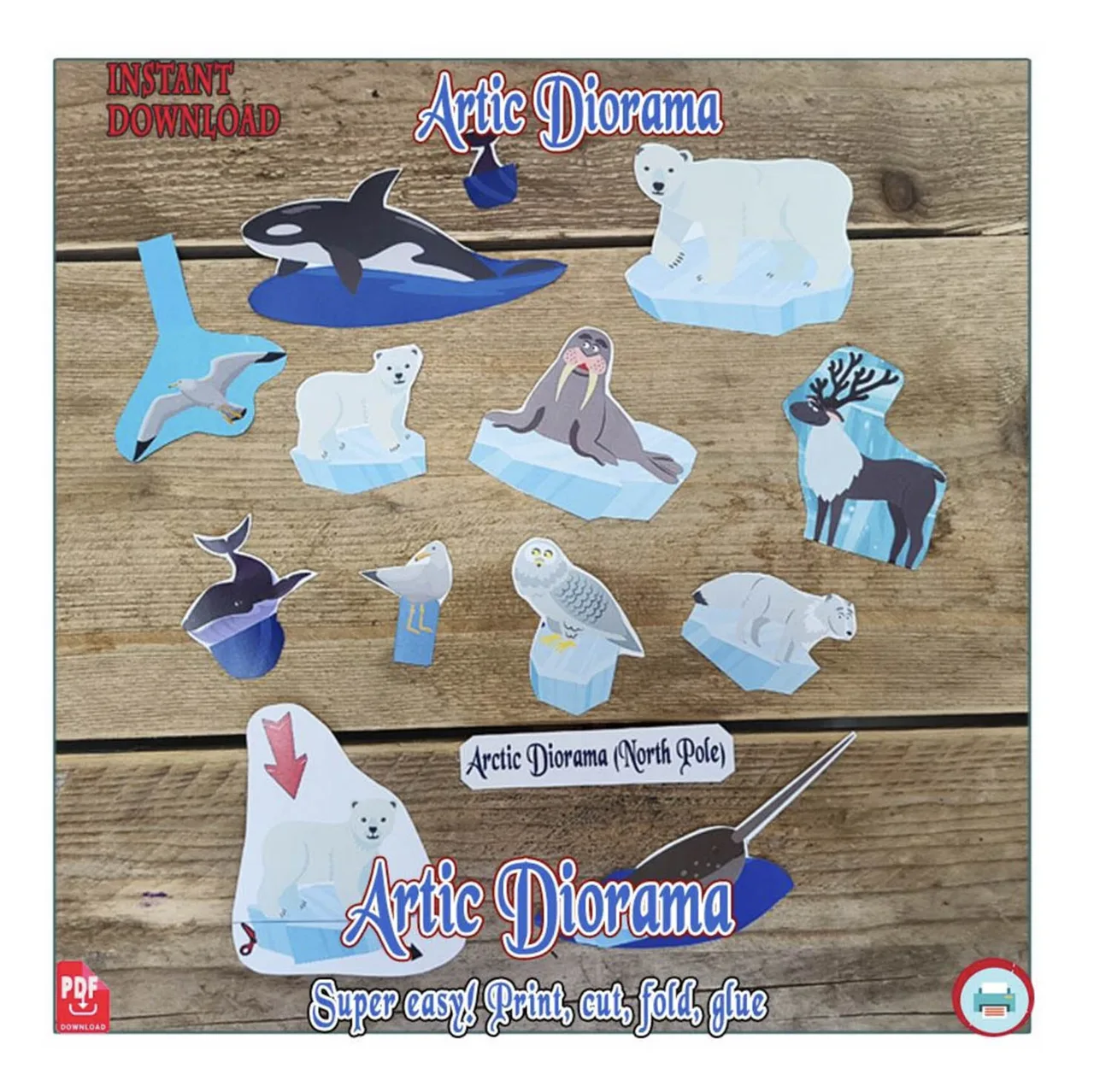 Cut-out Arctic paper animals laid on a table ready for a shoebox diorama