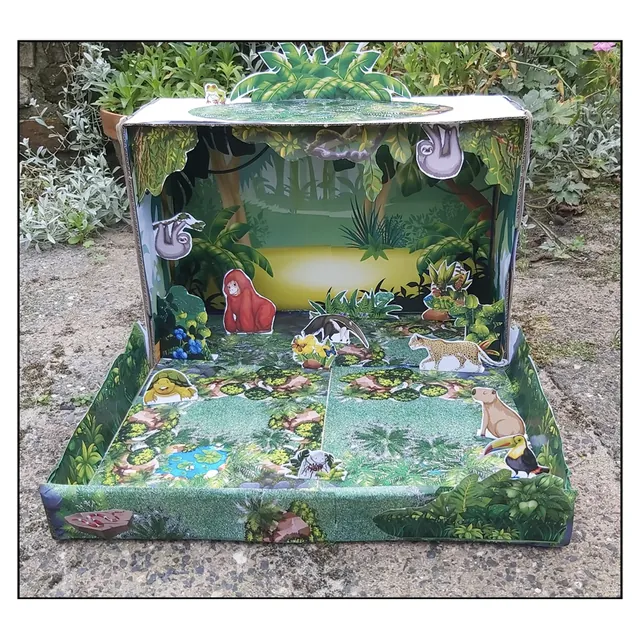 Diorama hutan hujan tropika dalam kotak kasut dengan pokok, tumbuhan dan haiwan kertas