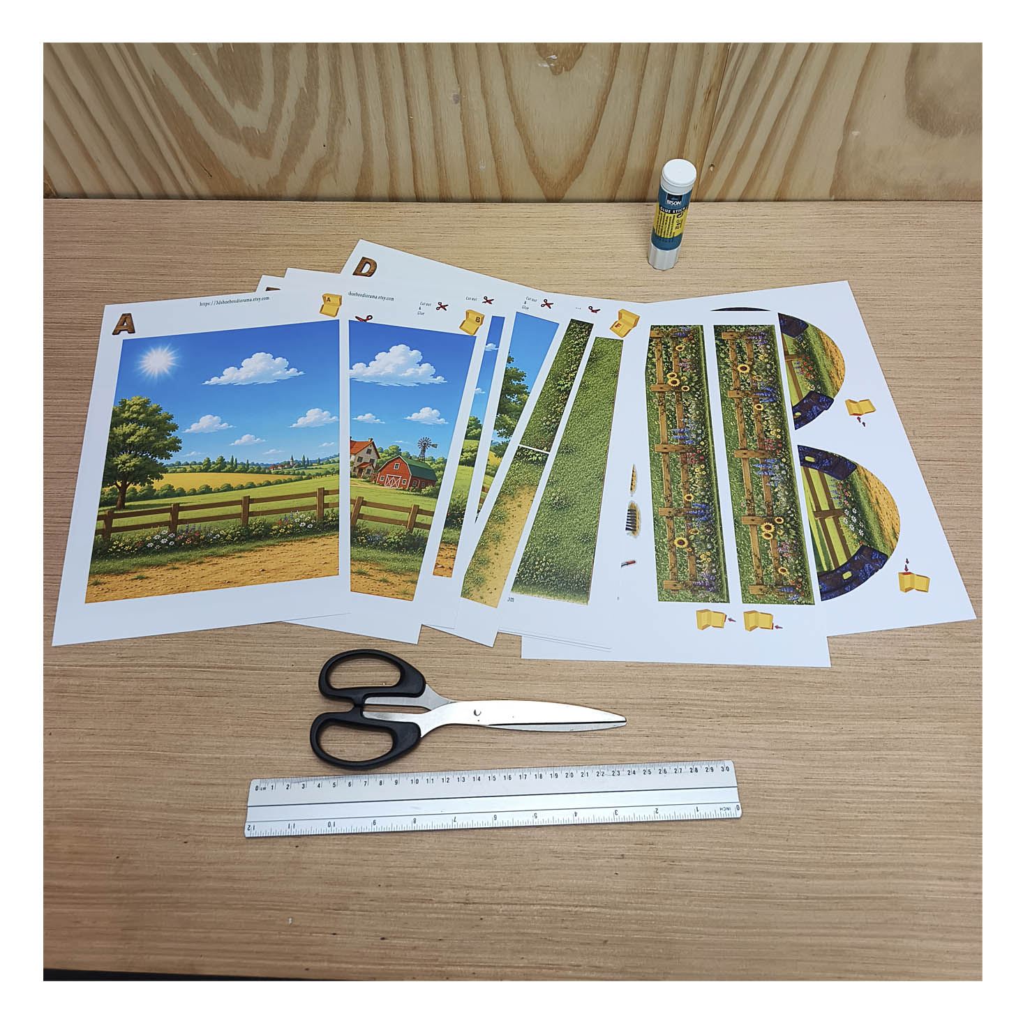 Printed horse stable diorama pages with colorful paddock backgrounds, paper horses, scissors and glue ready for a kids craft project
